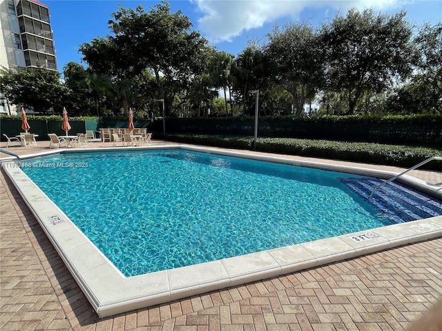 3301 N Country Club Dr Unit 612, Aventura, FL 33180 - community pool featuring a patio and fence