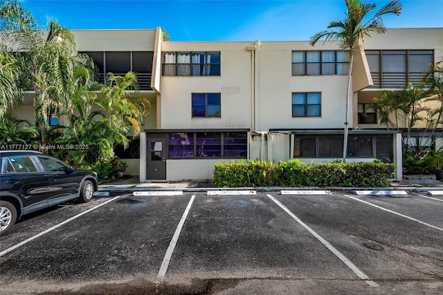 view of property with uncovered parking