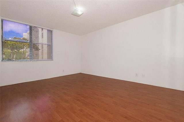 unfurnished room featuring wood finished floors