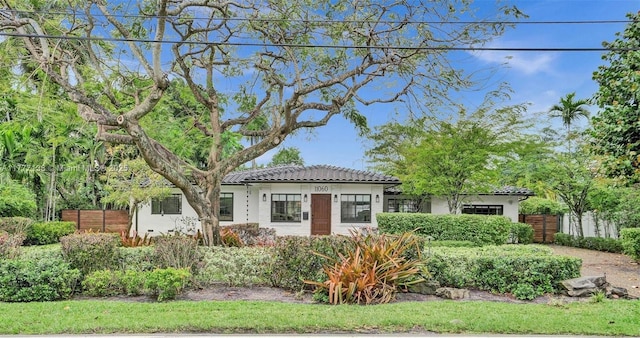 11060 Griffing Blvd, Biscayne Park, FL 33161 - view of front of house with a tiled roof and fence