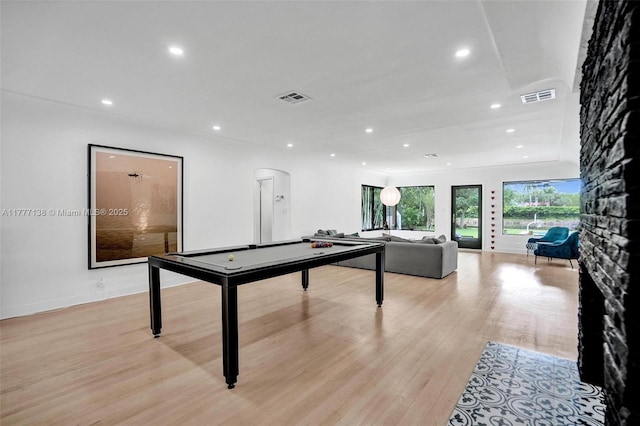 11060 Griffing Blvd, Biscayne Park, FL 33161 - recreation room featuring visible vents, light wood-type flooring, arched walkways, and recessed lighting