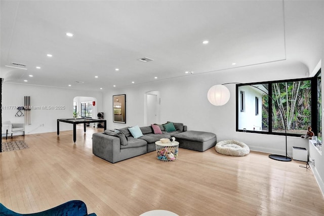 11060 Griffing Blvd, Biscayne Park, FL 33161 - living room featuring recessed lighting, arched walkways, visible vents, and light wood-type flooring