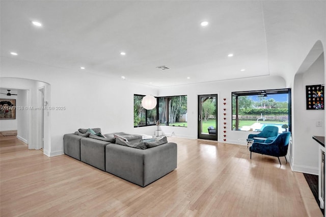 11060 Griffing Blvd, Biscayne Park, FL 33161 - living area with baseboards, light wood finished floors, arched walkways, and recessed lighting
