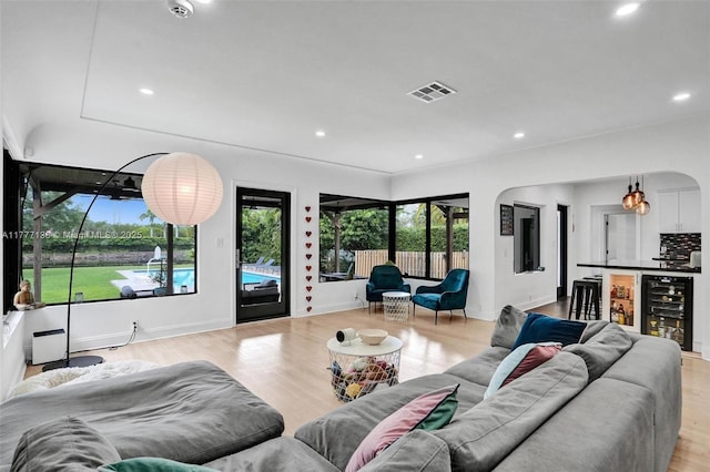 11060 Griffing Blvd, Biscayne Park, FL 33161 - living room featuring light wood-style floors, recessed lighting, visible vents, and beverage cooler