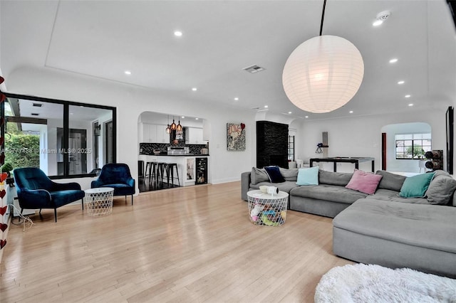 11060 Griffing Blvd, Biscayne Park, FL 33161 - living area featuring arched walkways, wood finished floors, visible vents, and recessed lighting
