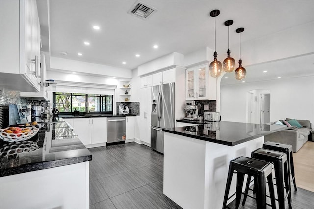 11060 Griffing Blvd, Biscayne Park, FL 33161 - kitchen featuring tasteful backsplash, visible vents, and appliances with stainless steel finishes