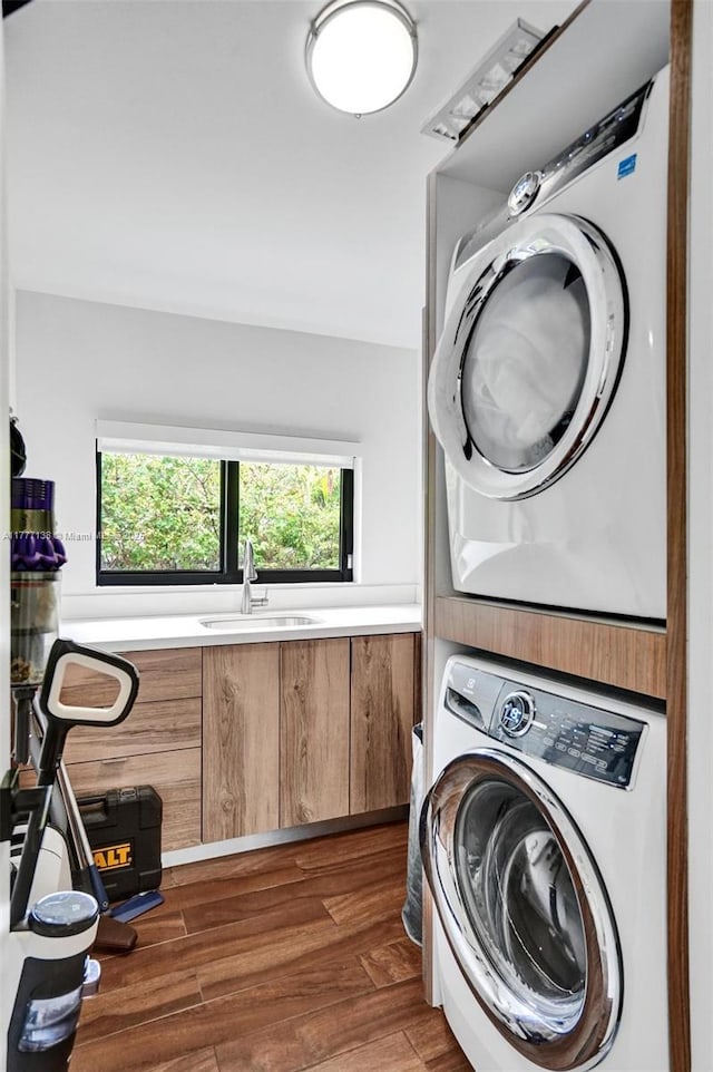 11060 Griffing Blvd, Biscayne Park, FL 33161 - laundry area with laundry area, stacked washer and clothes dryer, a sink, and dark wood finished floors