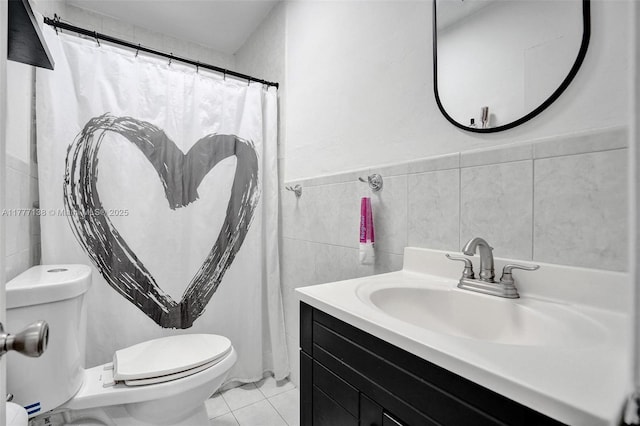 11060 Griffing Blvd, Biscayne Park, FL 33161 - bathroom featuring vanity, tile walls, a wainscoted wall, and toilet