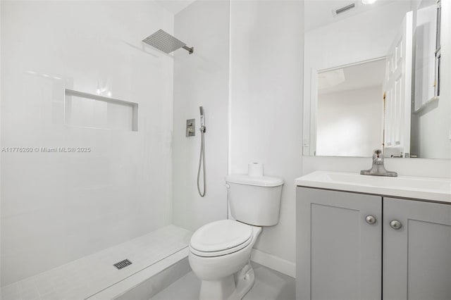 bathroom with vanity, visible vents, toilet, and tiled shower