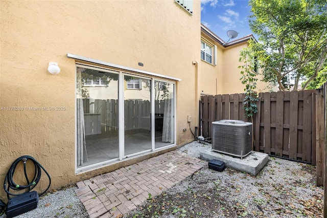 view of patio / terrace with fence and central AC unit