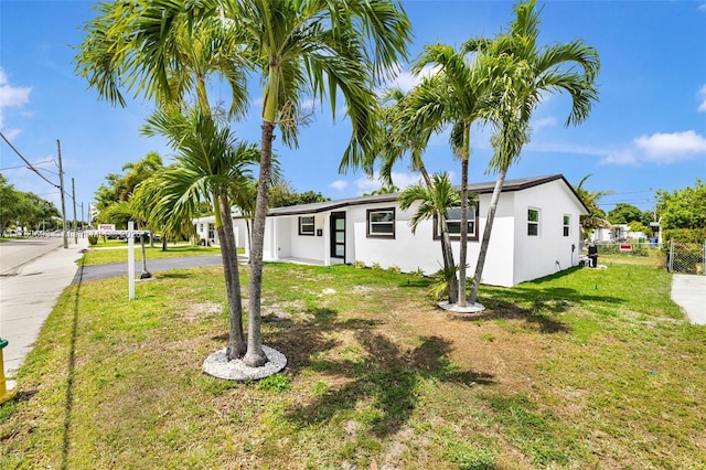 6335 Southgate Blvd, Margate, FL 33068 - single story home with a front lawn, stucco siding, and asphalt driveway