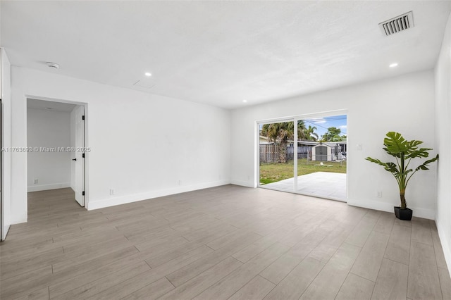 6335 Southgate Blvd, Margate, FL 33068 - empty room featuring wood finished floors, recessed lighting, baseboards, and a smoke detector