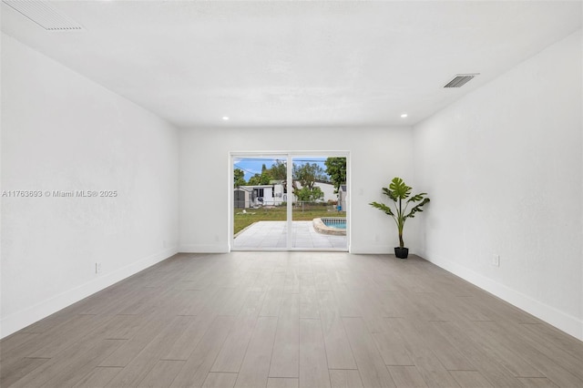 6335 Southgate Blvd, Margate, FL 33068 - spare room with wood finished floors, baseboards, and recessed lighting
