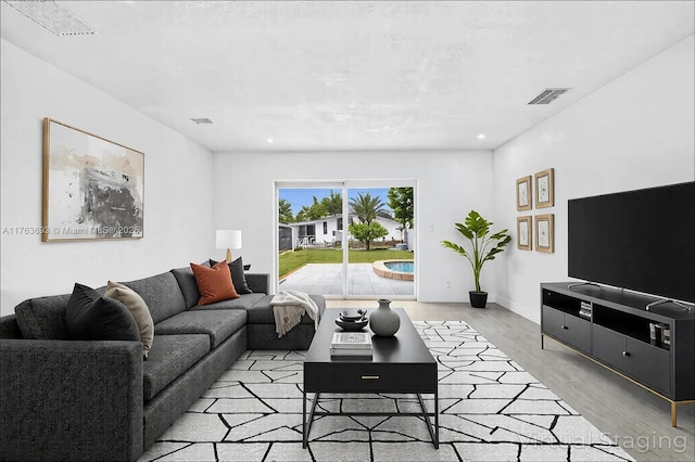 6335 Southgate Blvd, Margate, FL 33068 - living room featuring light wood-type flooring, baseboards, and recessed lighting