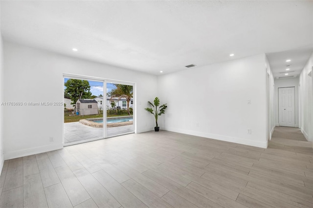 6335 Southgate Blvd, Margate, FL 33068 - empty room featuring recessed lighting, light wood finished floors, and baseboards
