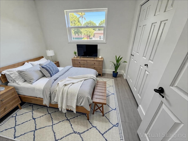 6335 Southgate Blvd, Margate, FL 33068 - bedroom with wood finished floors, baseboards, and a closet