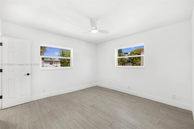 6335 Southgate Blvd, Margate, FL 33068 - unfurnished room featuring healthy amount of natural light, baseboards, and light wood finished floors