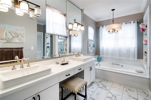 full bath featuring a garden tub, ornamental molding, a sink, and a chandelier
