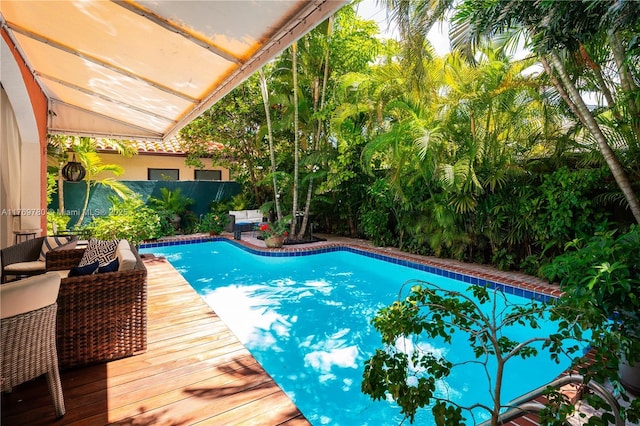 view of swimming pool with a fenced backyard and a fenced in pool