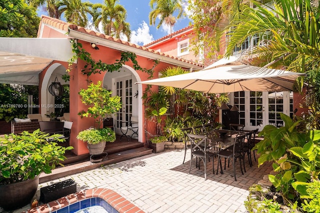view of patio with french doors and outdoor dining space