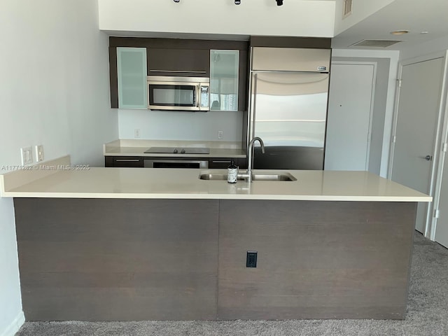 55 SE 6th St Unit 2404, Miami, FL 33131 - kitchen with light countertops, visible vents, modern cabinets, stainless steel appliances, and a sink