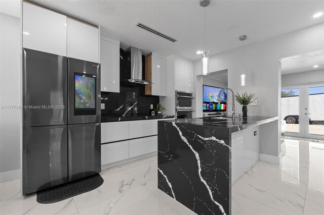 9025 SW 56th St, Miami, FL 33165 - kitchen with freestanding refrigerator, wall chimney exhaust hood, modern cabinets, white cabinetry, and recessed lighting