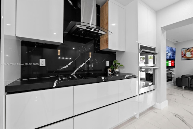 9025 SW 56th St, Miami, FL 33165 - kitchen with wall chimney exhaust hood, modern cabinets, white cabinetry, light marble finish floors, and double oven