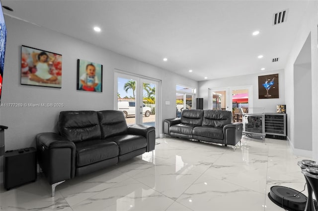9025 SW 56th St, Miami, FL 33165 - living room with french doors, wine cooler, recessed lighting, light marble finish flooring, and baseboards