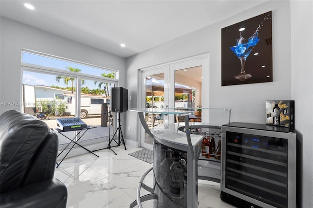 9025 SW 56th St, Miami, FL 33165 - bar with wine cooler, french doors, marble finish flooring, recessed lighting, and baseboards