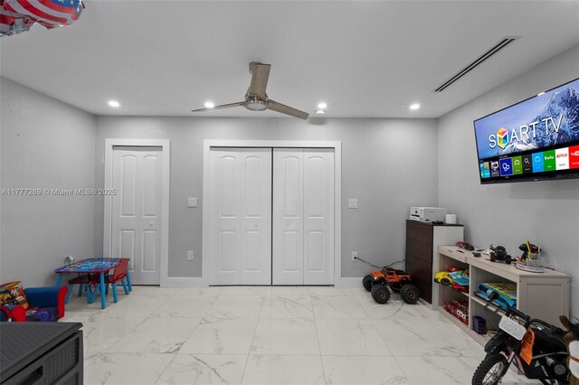 9025 SW 56th St, Miami, FL 33165 - recreation room featuring recessed lighting, ceiling fan, and marble look tile flooring