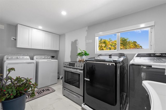 9025 SW 56th St, Miami, FL 33165 - laundry area with washer and dryer, light marble finish floors, recessed lighting, and cabinet space