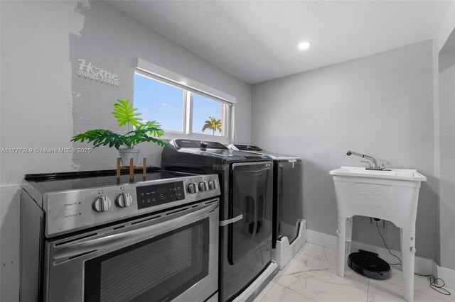 9025 SW 56th St, Miami, FL 33165 - washroom with washer and clothes dryer, light marble finish flooring, and baseboards