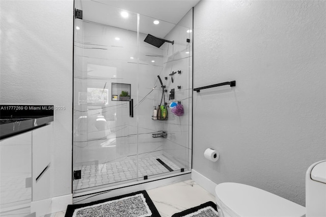 9025 SW 56th St, Miami, FL 33165 - full bath featuring toilet, marble look tiles, a shower stall, a textured wall, and baseboards