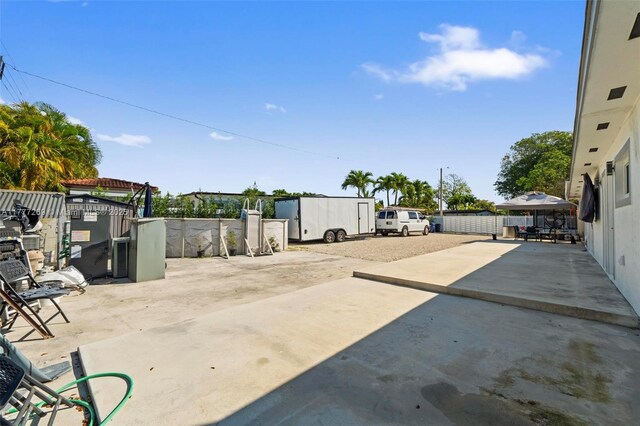 9025 SW 56th St, Miami, FL 33165 - view of patio featuring concrete driveway
