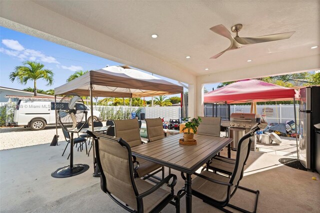 9025 SW 56th St, Miami, FL 33165 - view of patio / terrace with outdoor dining area, a grill, ceiling fan, and a gazebo