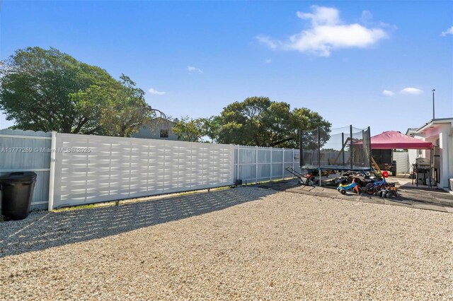 9025 SW 56th St, Miami, FL 33165 - view of yard with a trampoline