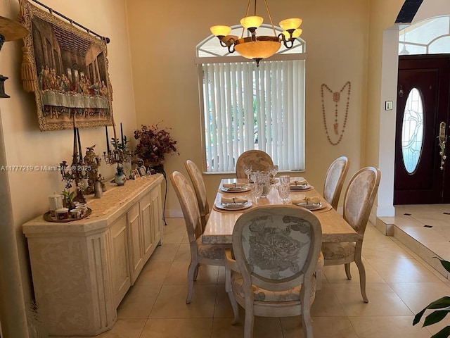 12421 SW 76th St, Miami, FL 33183 - dining room with a notable chandelier, baseboards, and light tile patterned flooring