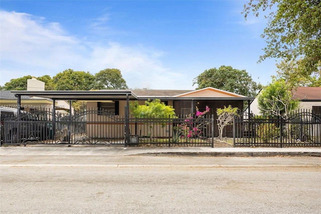 view of front of house with a fenced front yard and a gate