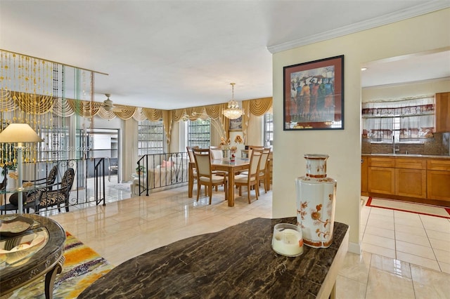 dining area featuring light tile patterned flooring, a notable chandelier, and crown molding