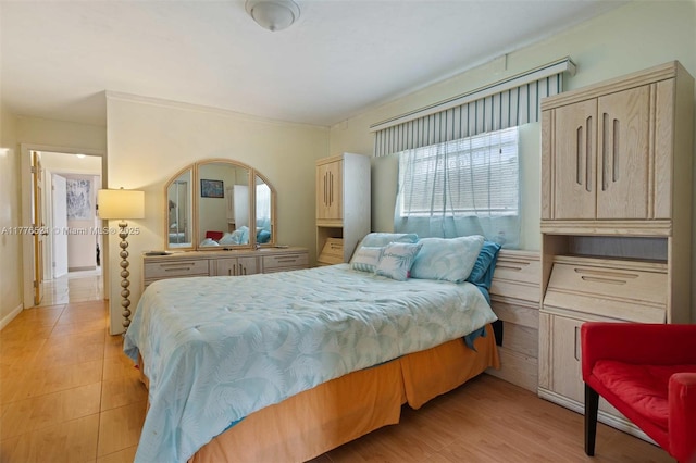 bedroom with light wood finished floors