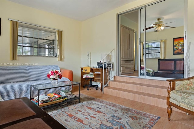sitting room featuring ceiling fan