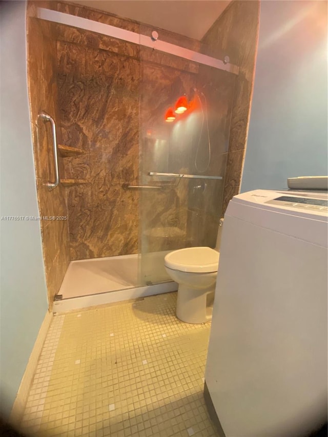 1801 S Surf Rd Unit 2A, Hollywood, FL 33019 - bathroom featuring a stall shower, toilet, and tile patterned floors