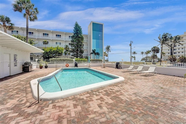 1801 S Surf Rd Unit 2A, Hollywood, FL 33019 - community pool featuring a patio, grilling area, and fence