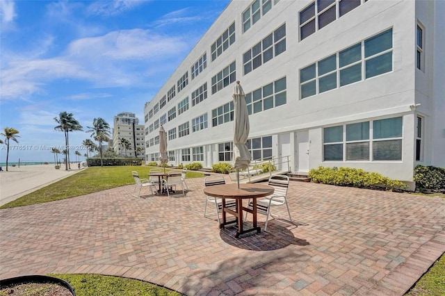 view of community with a patio and a yard