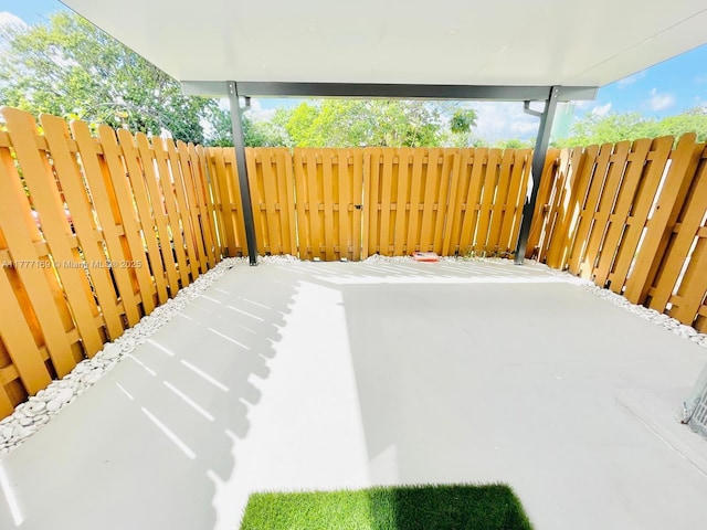 view of patio featuring fence