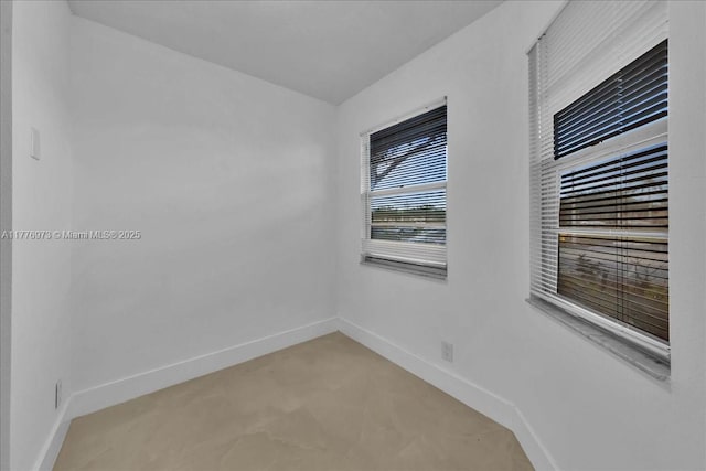 650 SW 124th Ter Unit 105P, Pembroke Pines, FL 33027 - spare room featuring baseboards