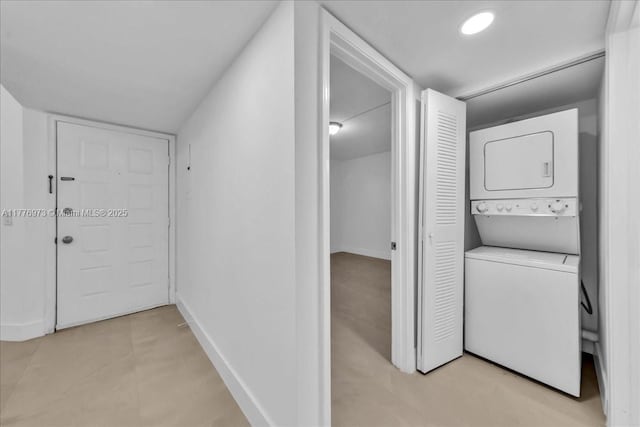650 SW 124th Ter Unit 105P, Pembroke Pines, FL 33027 - clothes washing area featuring stacked washer / drying machine and baseboards