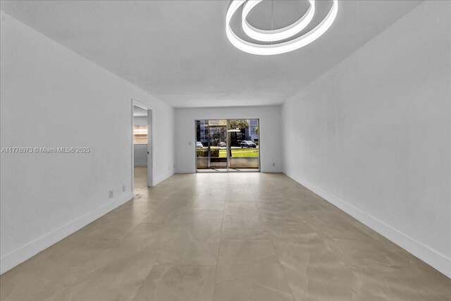 650 SW 124th Ter Unit 105P, Pembroke Pines, FL 33027 - unfurnished room featuring baseboards and concrete flooring