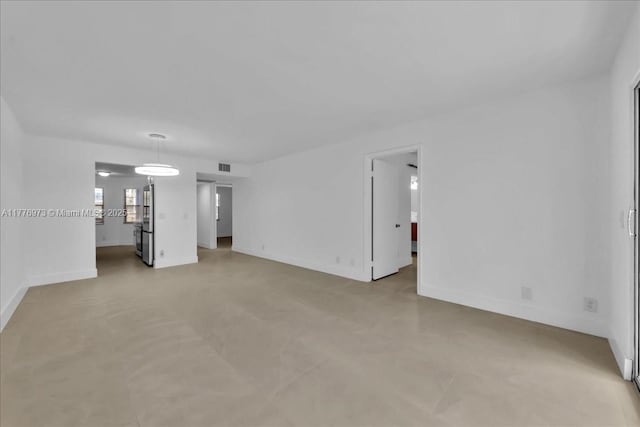 650 SW 124th Ter Unit 105P, Pembroke Pines, FL 33027 - unfurnished living room featuring baseboards