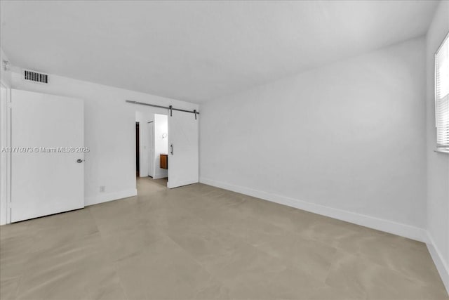 650 SW 124th Ter Unit 105P, Pembroke Pines, FL 33027 - unfurnished room with baseboards and a barn door